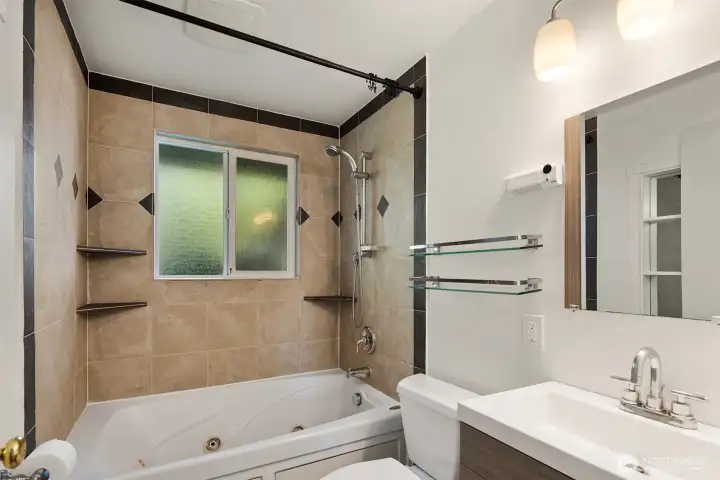 The main floor bathroom has an extra deep jetted soaking tub and shower.