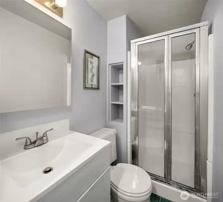 Upper level 3/4 bath with shower is shared by the two bedrooms.