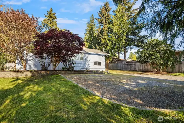 Ample off street parking both in front of the house and the long driveway that leads to the garage (garage not shown in photo).
