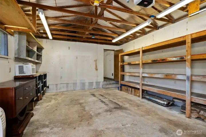 An interior view of the garage. The workshop is through the door in back.