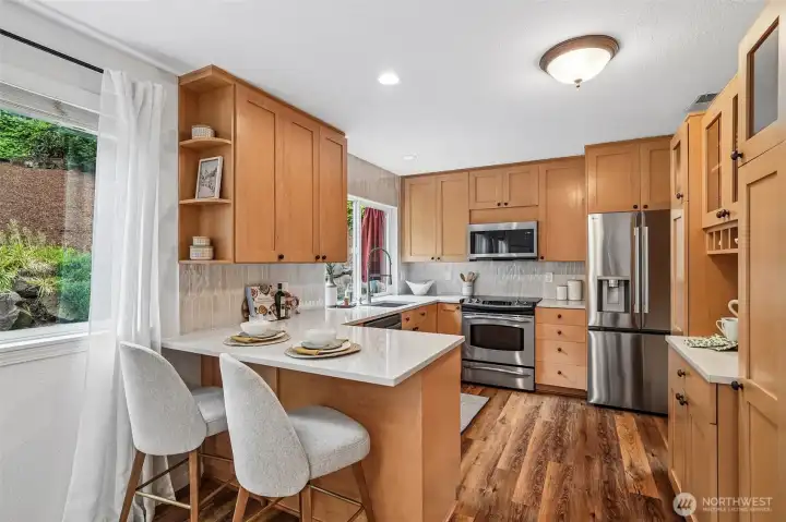 Maple cabinetry and new stainless steel appliances. Maple cabinetry and new stainless steel appliances.
