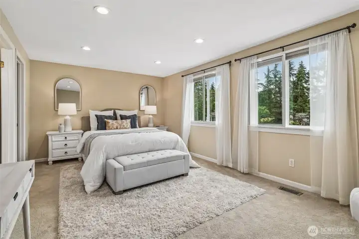 Spacious primary bedroom with ensuite bath. Spacious primary bedroom with ensuite bath.