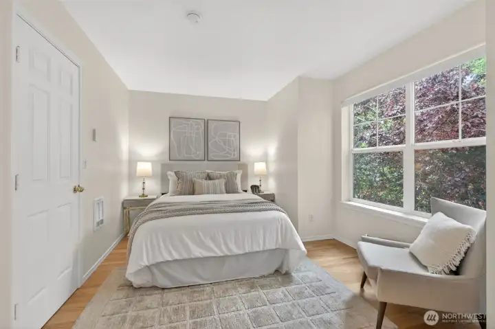 One of two upstairs bedrooms with real wood floors. To the right is large walk-in closet and shared en-suite bath.
