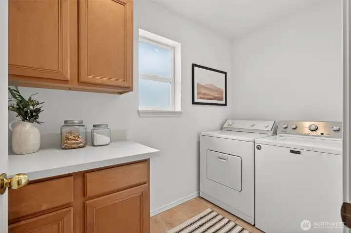 Upstairs is a full laundry room. Very rare! provides excellent storage and no mess of a just a hall closet alternative. Convert into a 2nd bathroom someday?