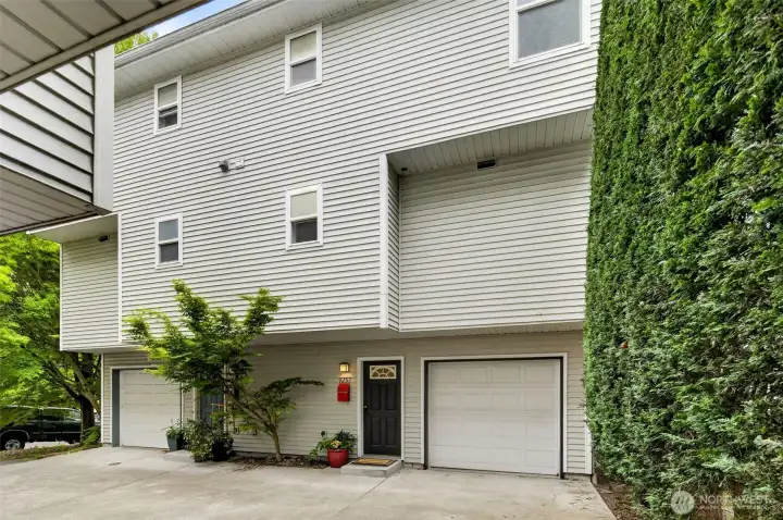 View from the front of the townhome and secure attached garage. No HOA, no dues, and no rental restrictions! Small townhome group with only 4 units total.