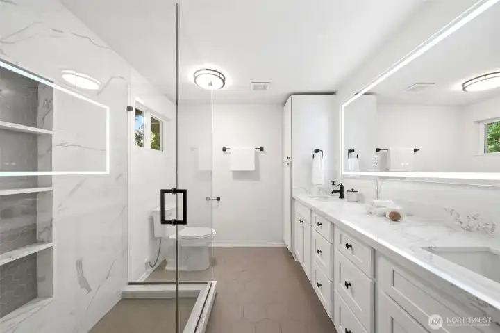 Spa-inspired primary bathroom remodel with heated floors, quartz countertops, custom tile, and modern finishes Spa-inspired primary bathroom remodel with heated floors, quartz countertops, custom tile, and modern finishes