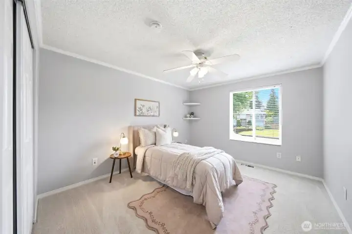 Spacious upstairs bedroom featuring natural light, fresh interior paint, and brand new carpet Spacious upstairs bedroom featuring natural light, fresh interior paint, and brand new carpet