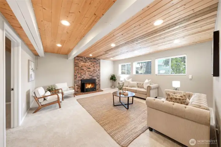 Beautiful lower-level retreat featuring a cedar ceiling, fireplace, and timeless character Beautiful lower-level retreat featuring a cedar ceiling, fireplace, and timeless character
