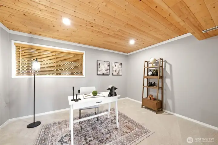 Versatile lower-level flex room perfect for a home office, guest space, fitness room, or additional living area Versatile lower-level flex room perfect for a home office, guest space, fitness room, or additional living area