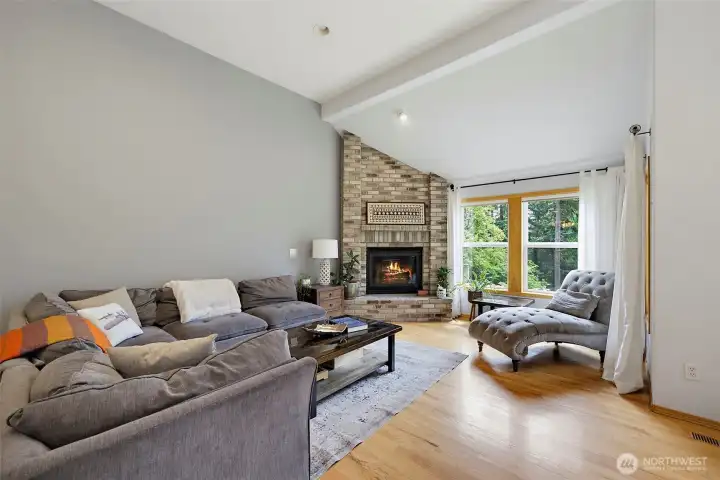 Impressive sized family room with vaulted ceilings, gas fireplace and hardwood floors.