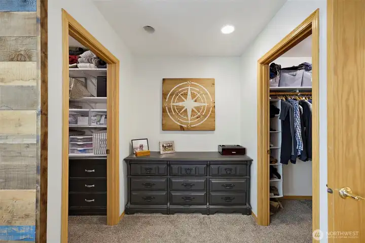 Primary suite with double walk-in fully organized closets.