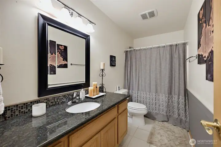 Main level full bathroom.