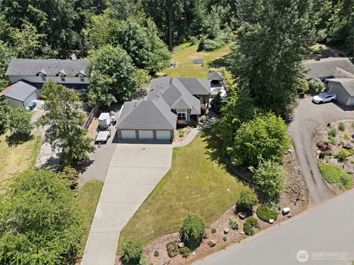 LOTS OF PARKING!! Three car attached garage, RV parking + plenty of room in the driveway for all of you guests!