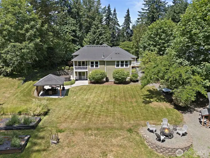 Located on .68 acre lot with flat useable backyard- maybe a pool is an option here? The firepit, raised garden beds, outbuilding + covered gazebo make this backyard the perfect place to escape life's busy schedules.