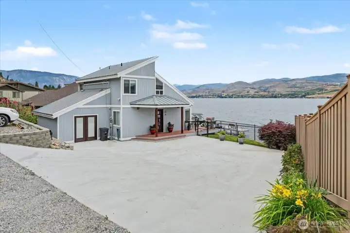 New concrete driveway with additional space to park at entry