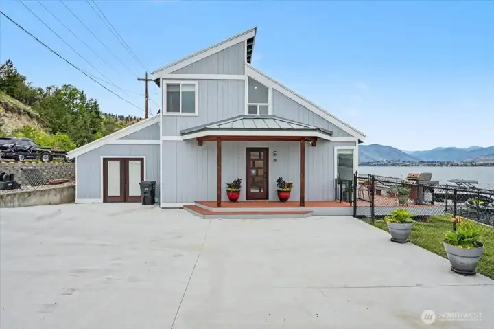 Brand-new concrete driveway with ample parking for up to four vehicles.