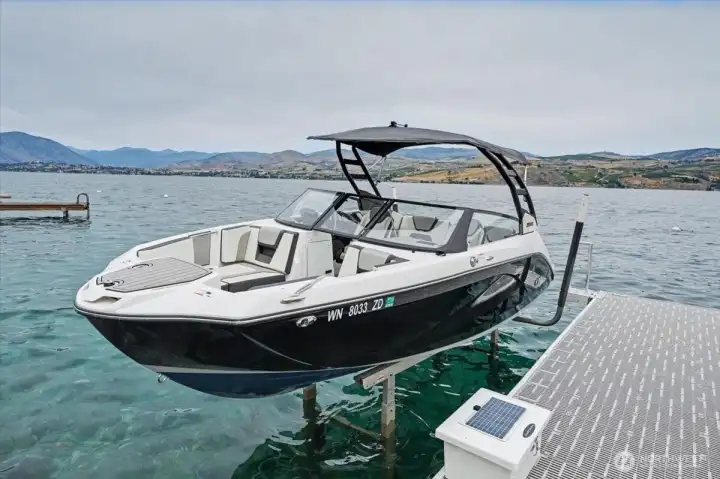 Brand-new 9,000-lb boat lift. The immaculate boat (only 300 hours!) is also available for purchase with the property.