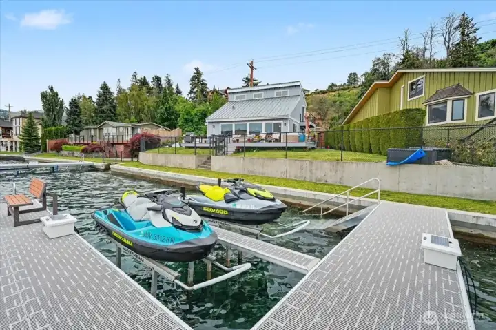 Turnkey lake life! Exceptional opportunity to purchase the jet skis along with the property.