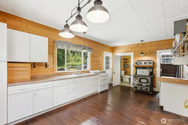 Kitchen with Antique Stove & Bathroom Door