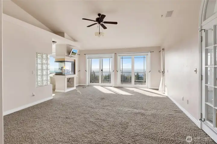 Primary bedroom is expansive and light filled