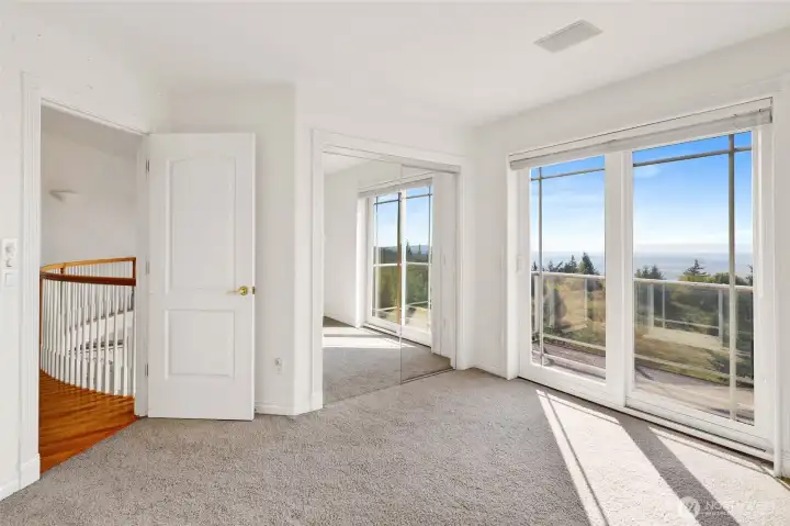Bedroom upstairs with views of Skagit Valley, the San Juan Islands, Whidbey and Camano Islands,  Bellingham Bay, Chuckanut Mountains, and the Olympic Peninsula.