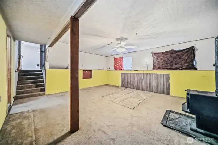 Spacious family room with a wood stove. Spacious family room with a wood stove.