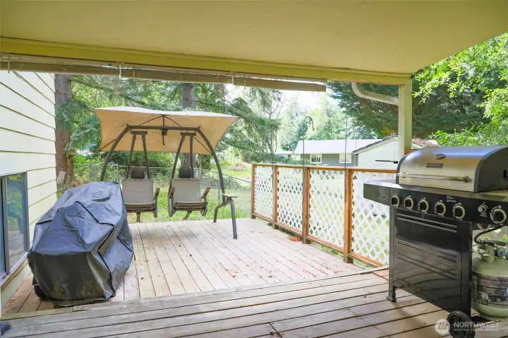 Large deck with covered and uncovered area. Perfect for entertaining rain or shine. Large deck with covered and uncovered area. Perfect for entertaining rain or shine.