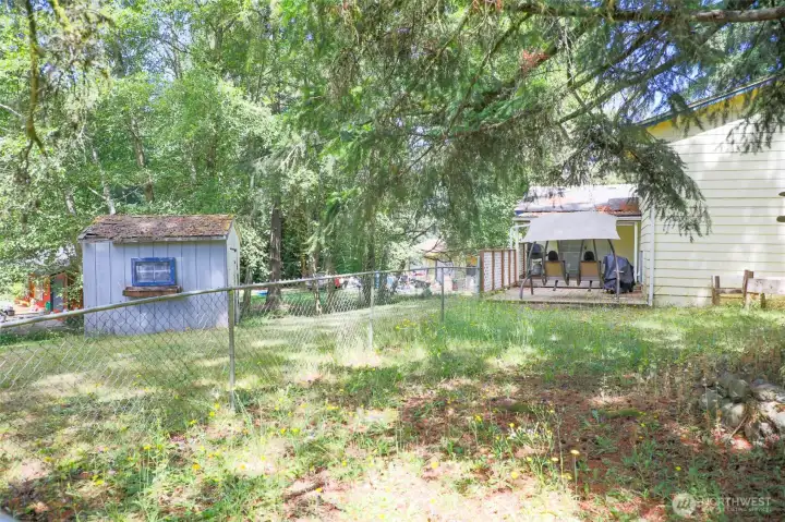 Side view of home and yard. Side view of home and yard.