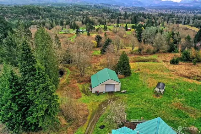 Huge garage, little cottage to your right. What a view!