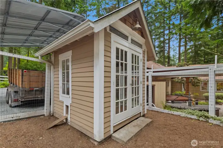 Chicken coop or hobby room off the back porch.