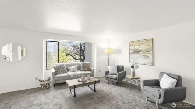An open floorplan seamlessly flows into the dining area and kitchen.