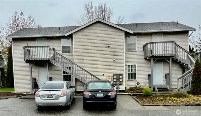 Front of 4 plex with parking