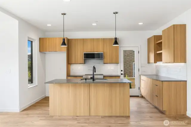 Kitchen features Quartz Countertops, Kitchenaide Stainless Appliance.  Plenty of cabinet space!