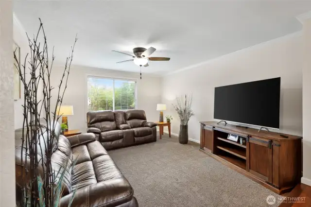 Coming out of the utility room down the hall, you passed by the formal living room into the back bedrooms