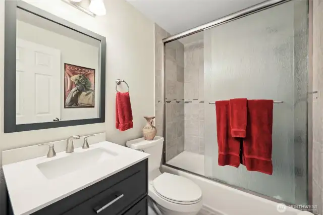 Full bathroom at the end of the hallway