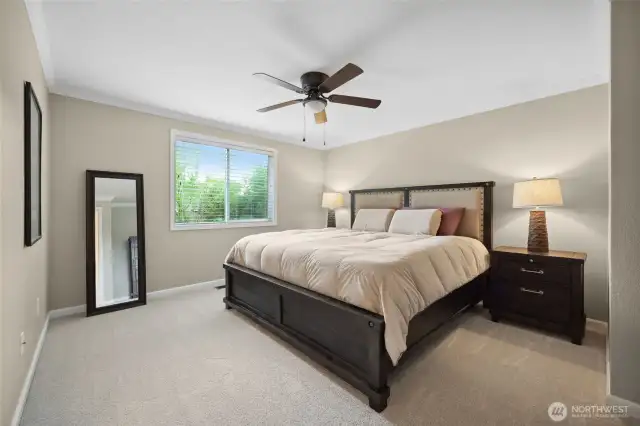 Main bedroom with updated carpet and lots of room