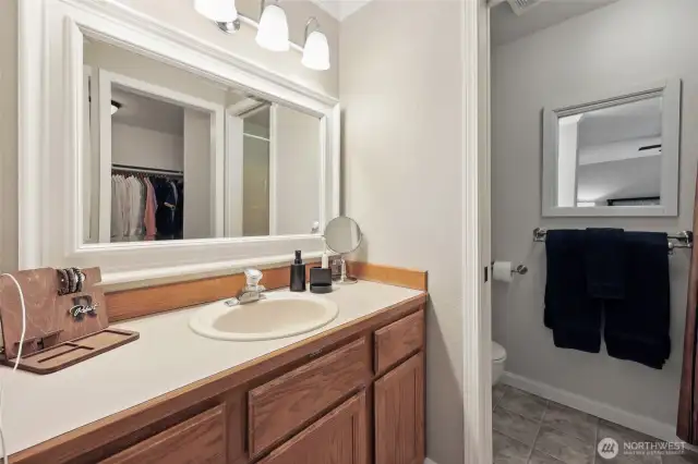 With separate vanity outside of shower room for added privacy
