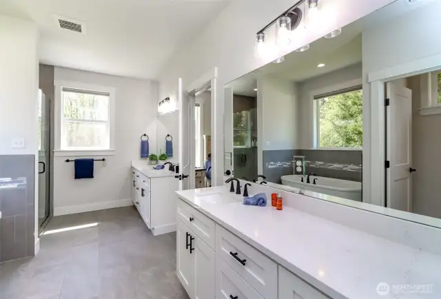 Primary bath with dual vanities and electric up down blinds.