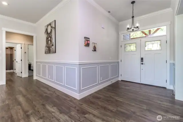 Entryway to open living room.