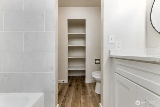 New vinyl flooring and trim. Storage shelves in 2nd level full bathroom.