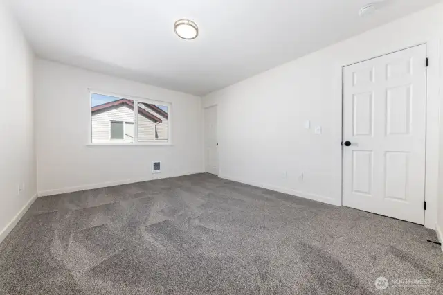 Primary bedroom with lots of natural lighting. Full bathroom connected to primary.