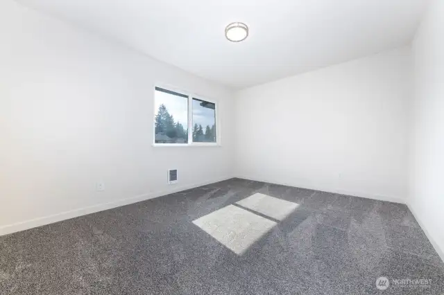 2nd bedroom on 2nd level with lots of natural light.