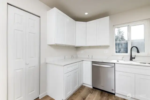 Lots of cabinets and a pantry on the left for storage.