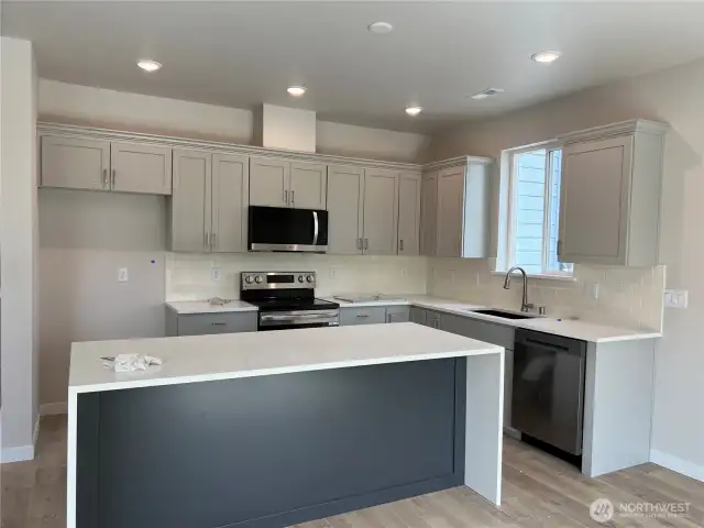 Under Construction- Kitchen w/ Quartz waterfall island