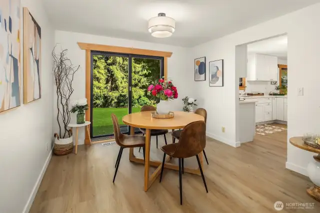 Dining room looking out to back yard, kitchen to the right