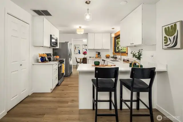 From Living room looking into the kitchen, then dining room