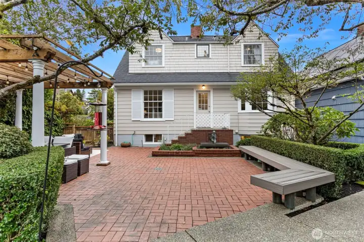 Rear of home featuring expansive patio.
