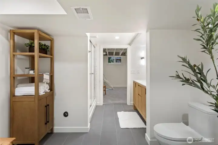 The spacious new bathroom has a nice area for changing and storing towels and bath items.