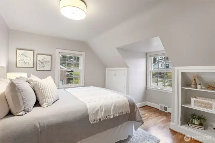 The second bedroom upstairs is also very large and can fit a large bed and dresser.  It also features built in drawers and shelves as well as a walk-in closet.
