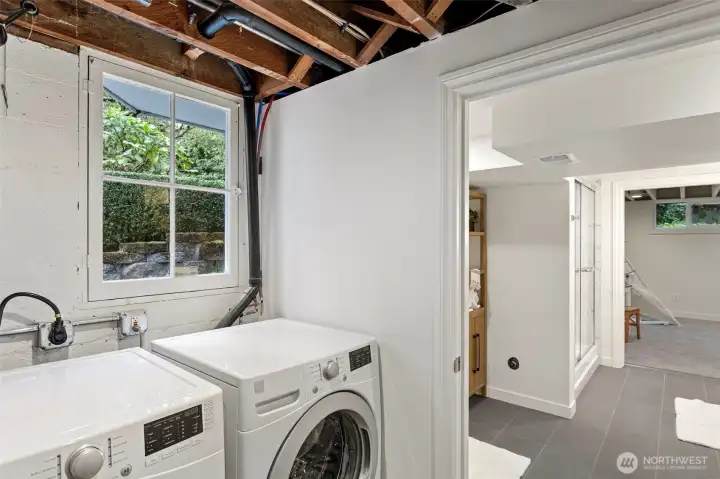 Just outside the lower level bathroom is a mud room and laundry area with a separate entry to outside, this area has a newly tiled floor.
